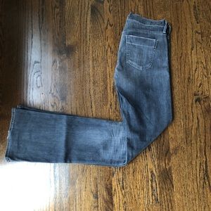 Dark grey, slightly distressed jean
